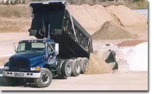Brady Sand & Gravel dump truck unloading material at the Tecumseh yard