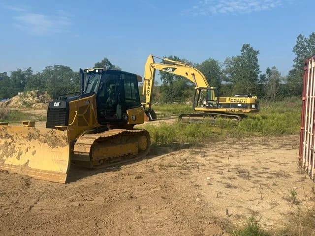 CAT dozer and Brady excavator working a cleared building site